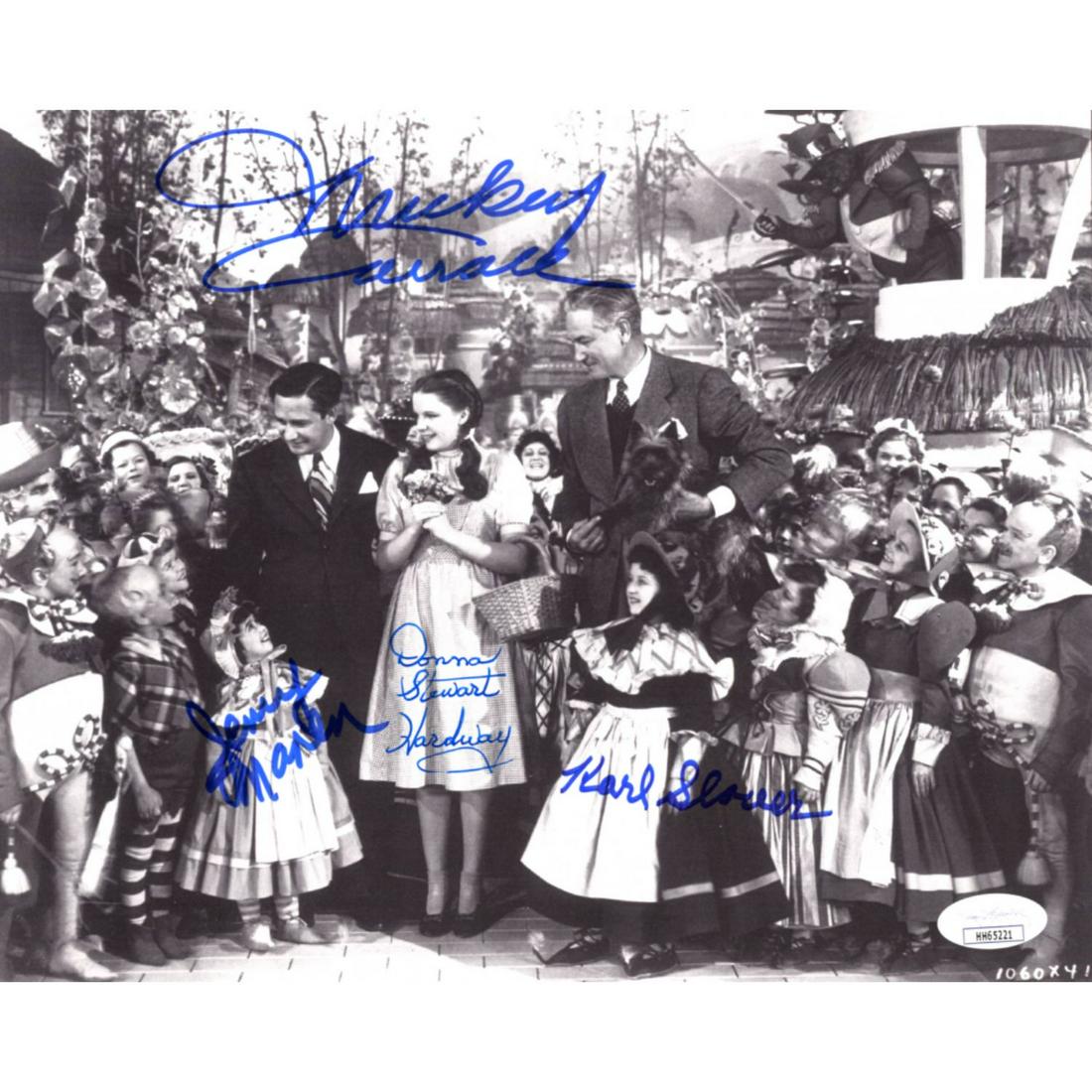 "The Wizard Of Oz" 8x10 Photo Cast-Signed by (4) with: Photo measures 8" x 10" in size and has been hand-signed by (4) including Mickey Carroll (D. 2009), Jerry Maren (D. 2018), Donna Stewart-Hardaway (D. 2008) and Karl Slover (D. 2011).The lot / autograp