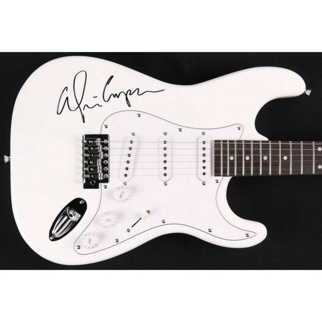 Alice Cooper Signed Full-Size Electric Guitar (JSA COA): Full-size non-branded electric guitar measures approximately 39" in length and is hand-signed on the body by Alice Cooper.