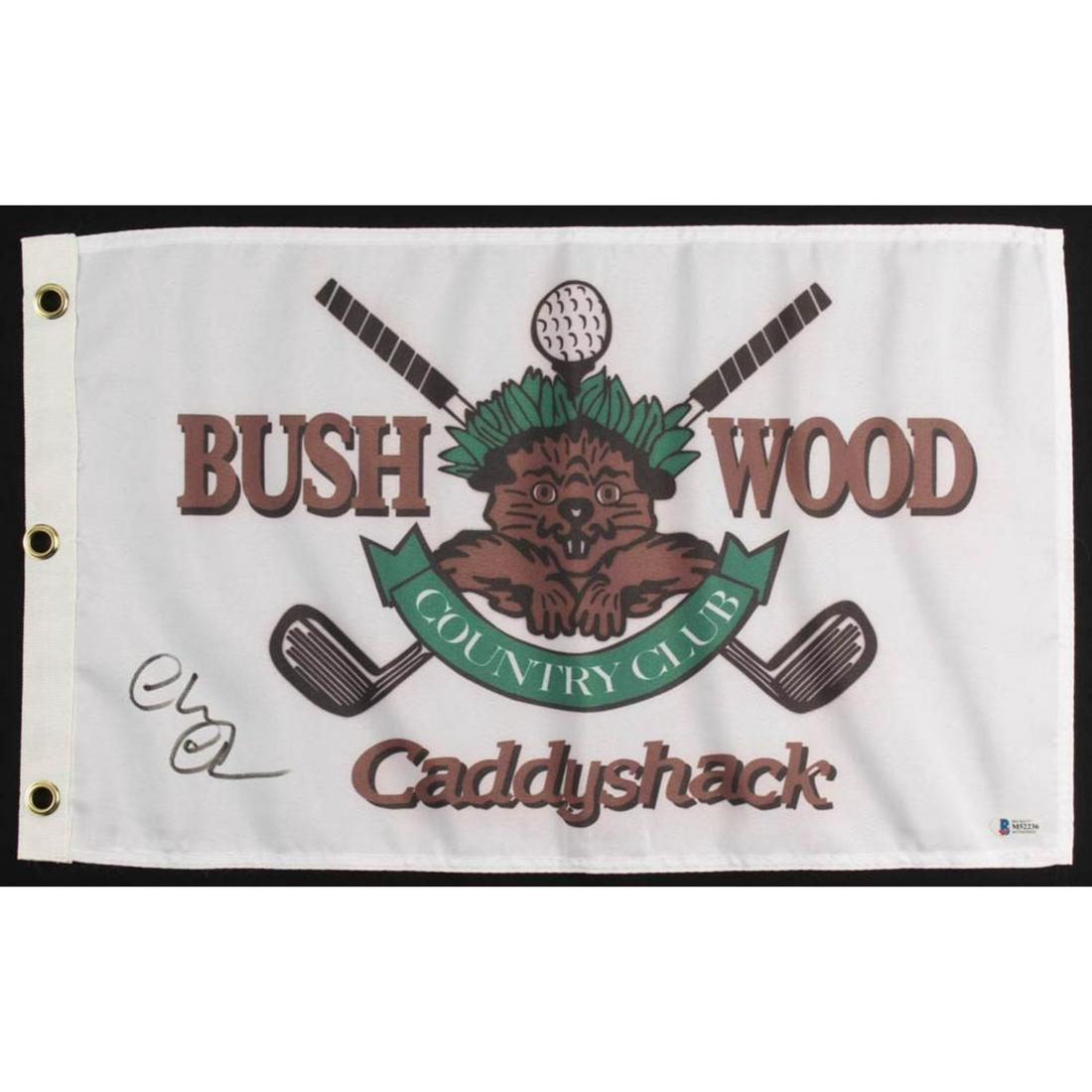 Chevy Chase Signed "Caddyshack" Bushwood Country Club: Pin flag measures approximately 12" x 20" in size and has been hand-signed in black felt-tip pen by Chevy Chase (Ty Webb).The lot / autograph(s) includes an official Beckett Authentication Services se