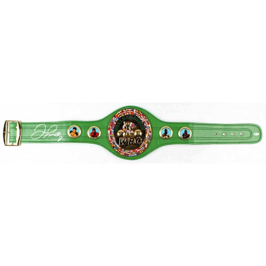 Floyd Mayweather Jr. Signed Full-Size WBC Heavyweight Championship Belt (Beckett COA): Full-size replica WBC Heavyweight Championship belt has been hand-signed by Floyd Mayweather Jr. The belt includes thick metal plates and faux leather. The lot / autograph(s) includes an official Beck