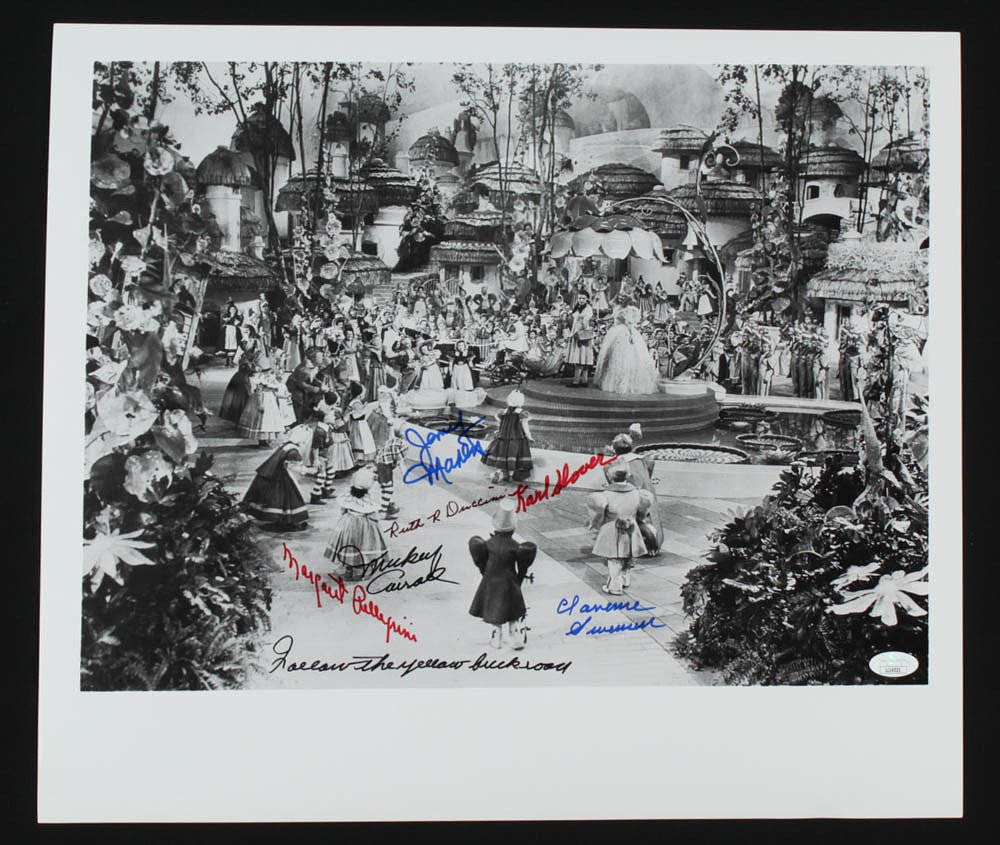 "The Wizard of Oz" 16x18.5 Photo Cast-Signed *6 signatures* (JSA COA): "The Wizard of Oz" 16x18.5 Photo Cast-Signed by (6) with Karl Slover, Margaret Pellegrini, Clarence Swensen Inscribed "Follow the Yellow Brick Road" (JSA COA)