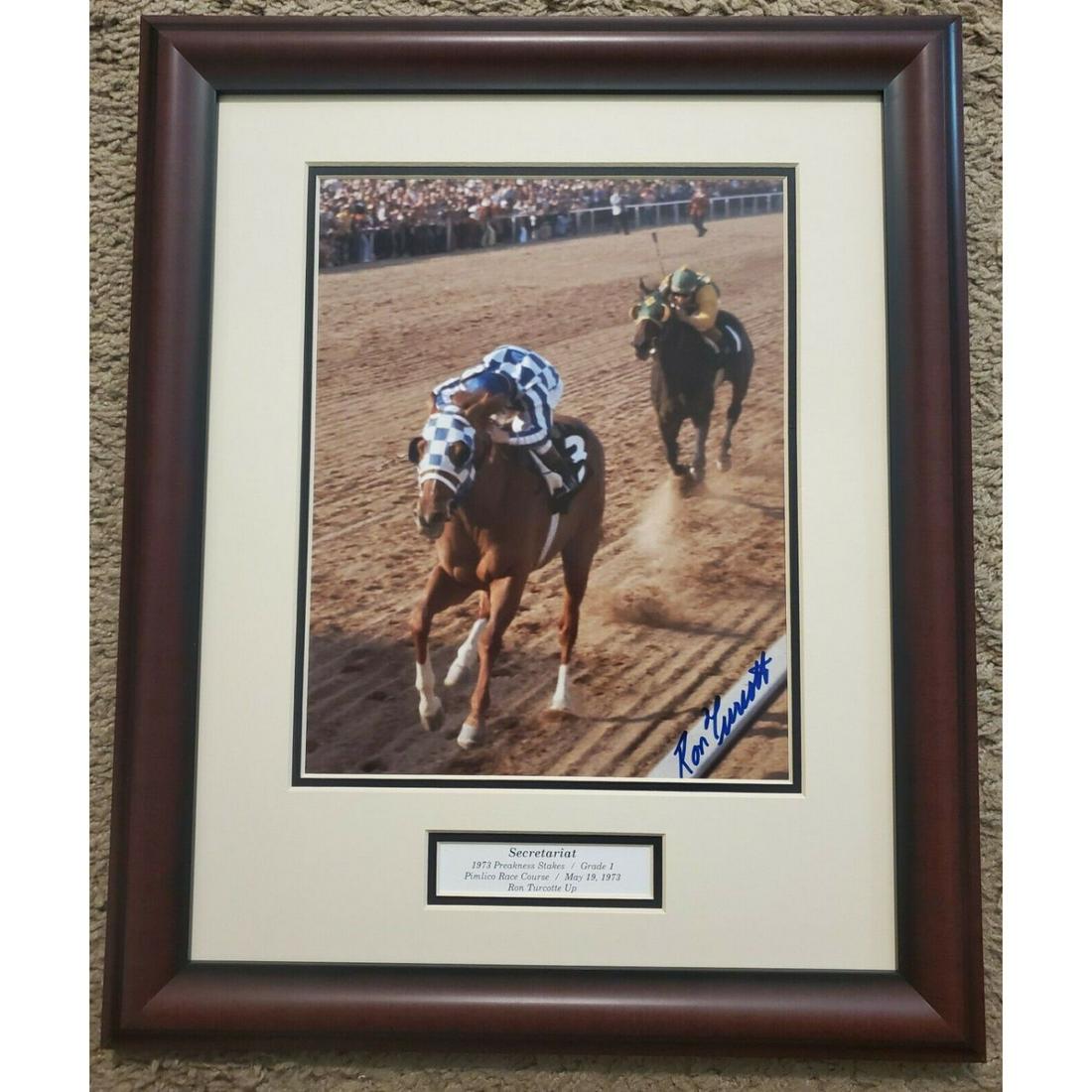 Secretariat 1973 Preakness BAS: Secretariat defeats Sham again in the 1973 Preakness Stakes. 8" x 10" signed by winning rider Ron Turcotte and Laffit Pincay Jr. who rode Sham. Beautifully matted with identifying keyway and mahogany