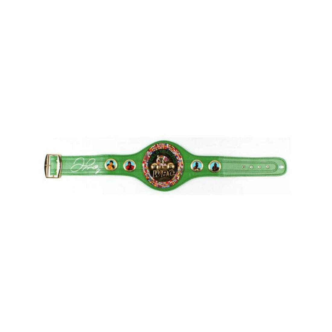 Floyd Mayweather Jr. Signed Full-Size WBC Heavyweight Championship Belt (Beckett COA): Full-size replica WBC Heavyweight Championship belt has been hand-signed by Floyd Mayweather Jr. The belt includes thick metal plates and faux leather. The lot / autograph(s) includes an official Beck