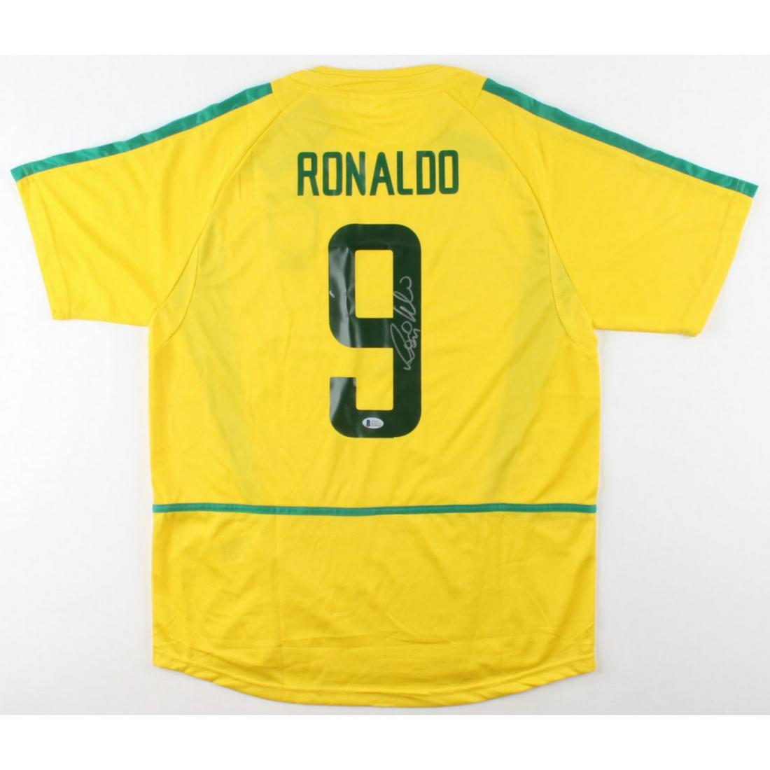 Ronaldo Signed Jersey (Beckett COA): Custom on-field style jersey. Everything is printed on, size XL. Has been hand-signed by Ronaldo.The lot / autograph(s) includes an official Beckett Authentication Services serially-numbered hologram 