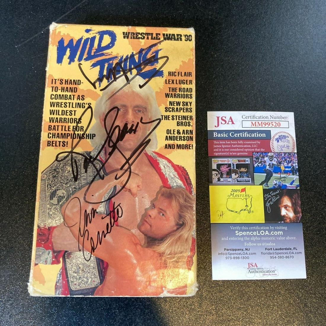 Ric Flair, Sting & Jim Cornette Signed "Wrestle War '90 Wild Thing" VHS (JSA COA): Ric Flair, Sting & Jim Cornette Signed "Wrestle War '90 Wild Thing" VHS (JSA COA)