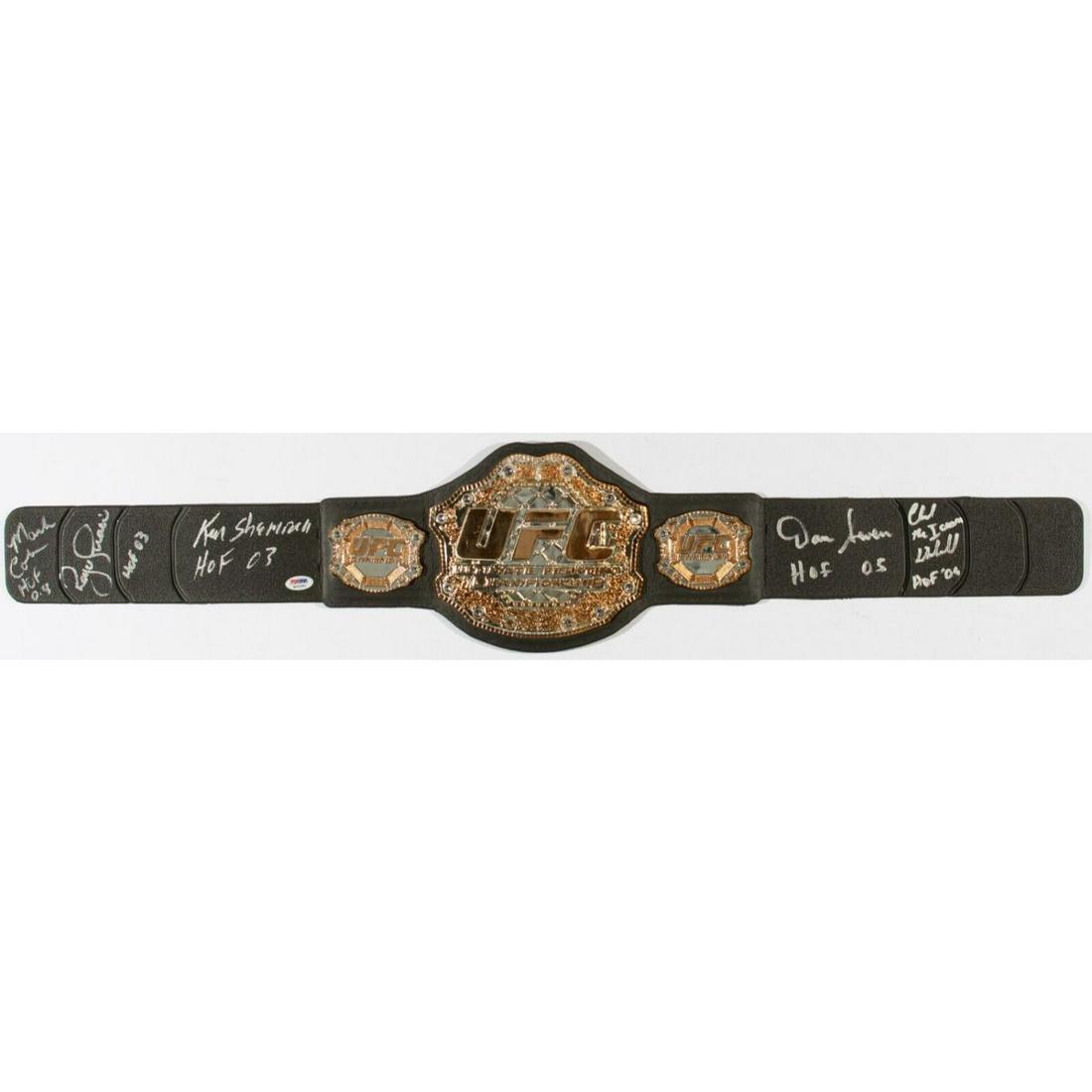 UFC Legends : Royce Gracie, Ken Shamrock, Chuck Lidell, Mark Coleman & Dan Severn Signed Replica UFC: UFC Legends : Royce Gracie, Ken Shamrock, Chuck Lidell, Mark Coleman & Dan Severn Signed Replica UFC Chamoipionship belt (PSA COA)