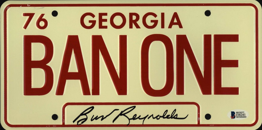 Burt Reynolds Signed "Smokey and the Bandit" 6x12 License Plate: "Smokey and the Bandit" license plate measures 6" by 12" in size and has been hand-signed by Burt Reynolds (D. 2018, Bo Darville "Bandit").The lot / autograph(s) includes an official Beckett Authentic