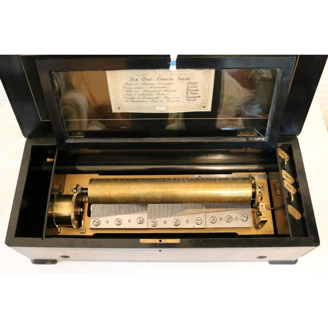 Swiss Antique 6.25"x22.5" Music Box: Swiss Antique 6.25"x22.5" Music Box . The case measures 22.5" (57cm) in width, 6.25" (16cm) height and 19" (23cm) depth. The cylinder measures approx. 13" in length. The 3 combs are complete with no d