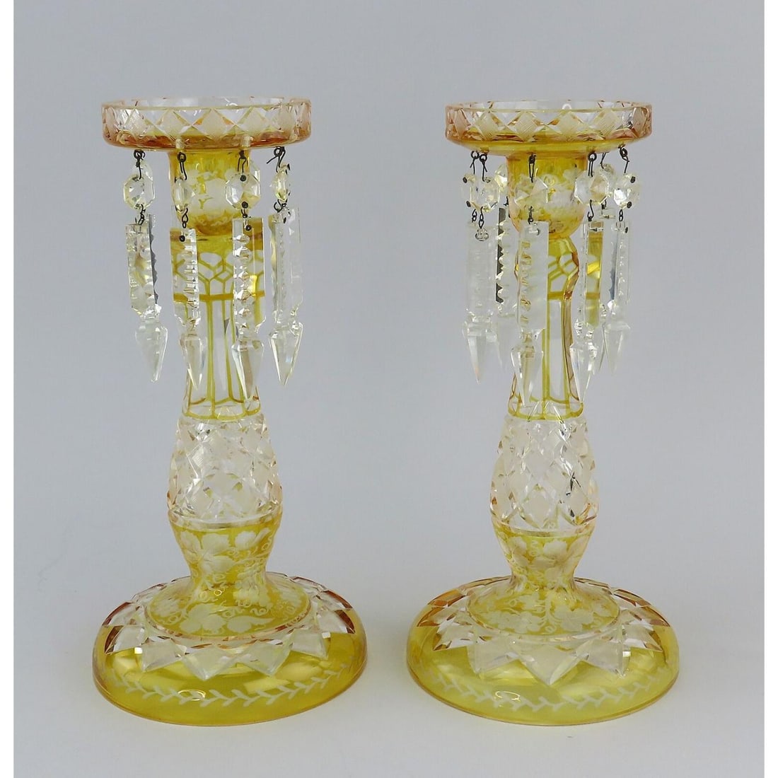 Pair 1800s Bohemian Amber Yellow Glass Mantle Lusters 11 1/4": Pair 1800s Bohemian Amber Yellow Glass Mantle Lusters 11 1/4". This pair is in great condition, especially considering age. There is a small chip on the top edge of one of the lusters. The pair stands