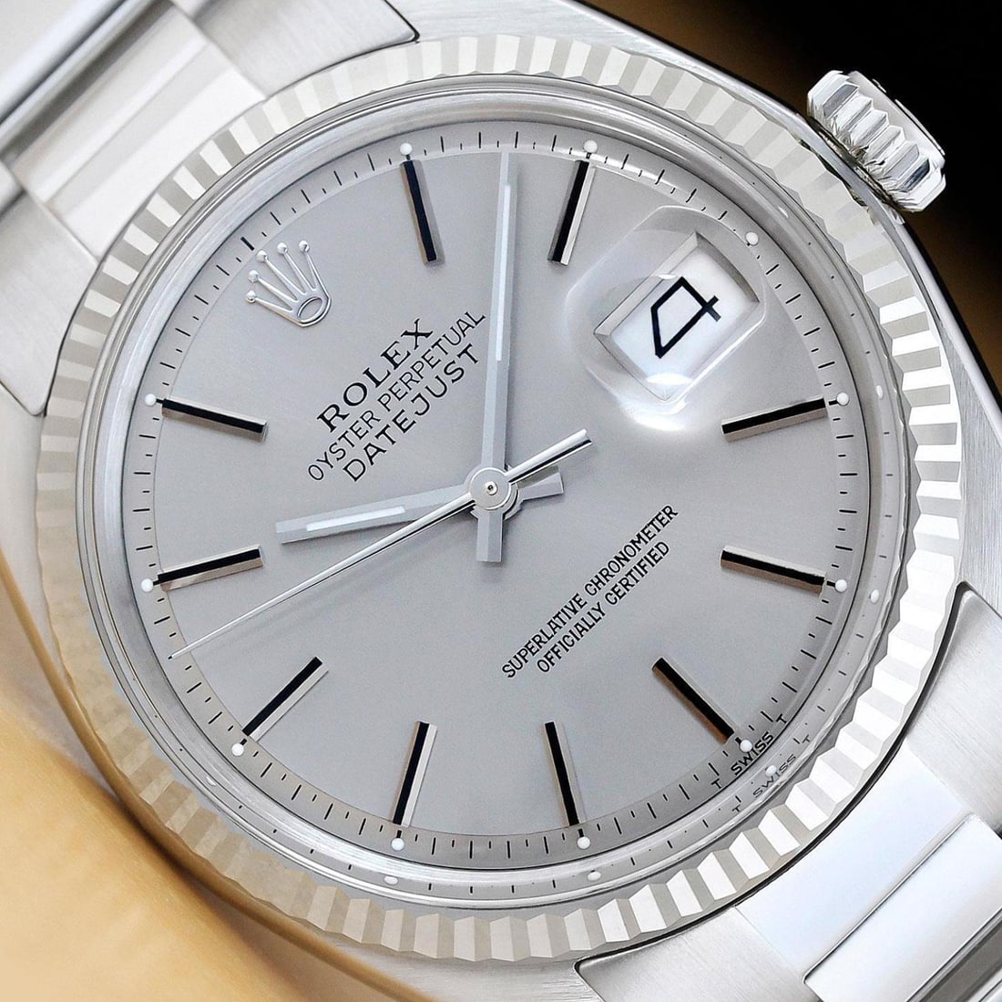 Mens 18k White Gold & Stainless Steel Rolex Datejust With A Gray Dial & Oyster Band: Mens 18k White Gold & Stainless Steel Rolex Datejust With A Gray Dial & Oyster Band . This is an authentic Rolex watch with a Rolex 18K white gold fluted bezel, Rolex stick dial, and custom stainless