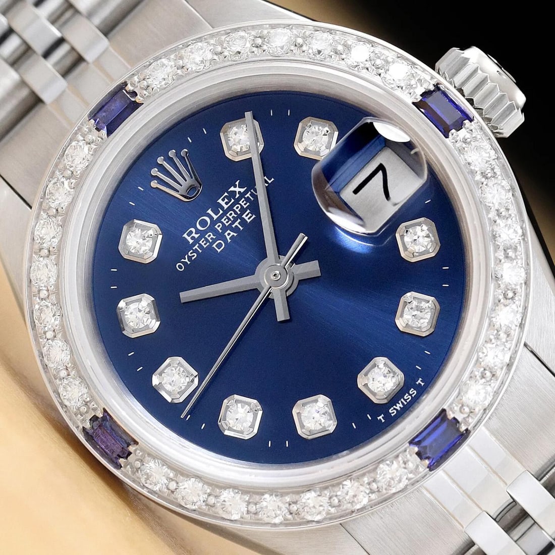 LADIES ROLEX DATE DIAMOND SAPPHIRE 18K WHITE GOLD & STEEL BLUE DIAL WATCH: LADIES ROLEX DATE DIAMOND SAPPHIRE 18K WHITE GOLD & STEEL BLUE DIAL WATCH (This is an authentic Rolex watch with a Rolex dial with added genuine diamond markers, custom 18K white gold sapphire diamond