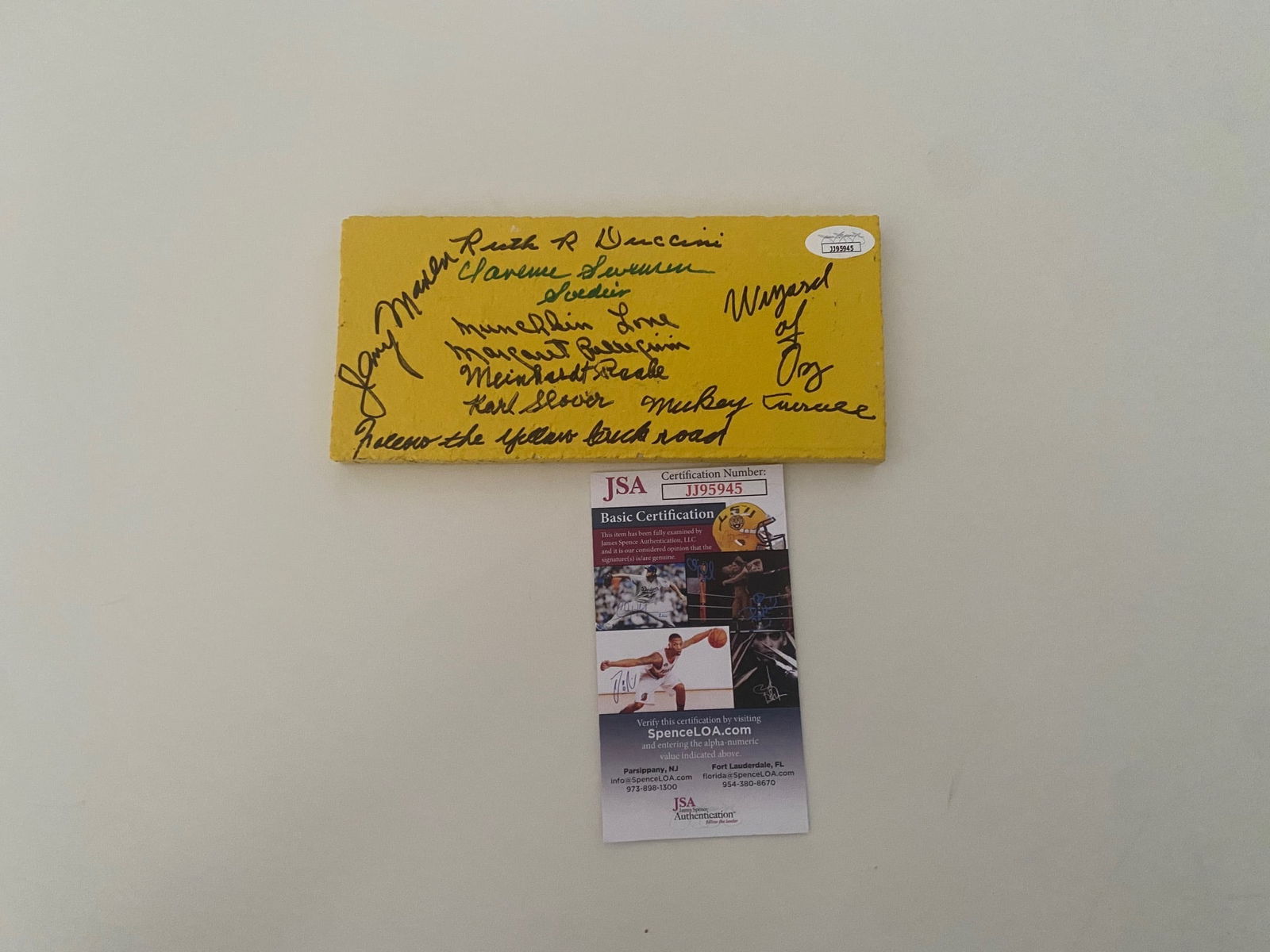 Wizard of OZ CAST SIGNED PRINT: Maren, Carroll, Swenson, Slover, Pelligrini, Duccini & Raabe Signed The Wizard of Oz Yellow Brick (JSA COA)This autographed yellow brick has been personally hand-signed by The Wizard of Oz cast member