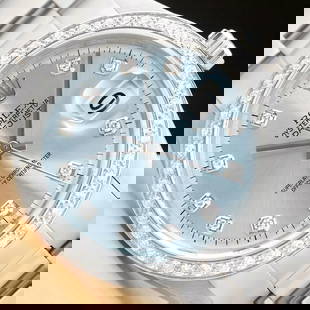 MENS ROLEX DATEJUST ICE BLUE DIAL 18K WHITE GOLD DIAMOND BEZEL & STEEL WATCH: This is an authentic Rolex watch with a Rolex dial with added diamond markers, custom 18K white gold diamond bezel, and custom stainless steel oyster bracelet.Descriptions: Brand:RolexModel:DatejustRe