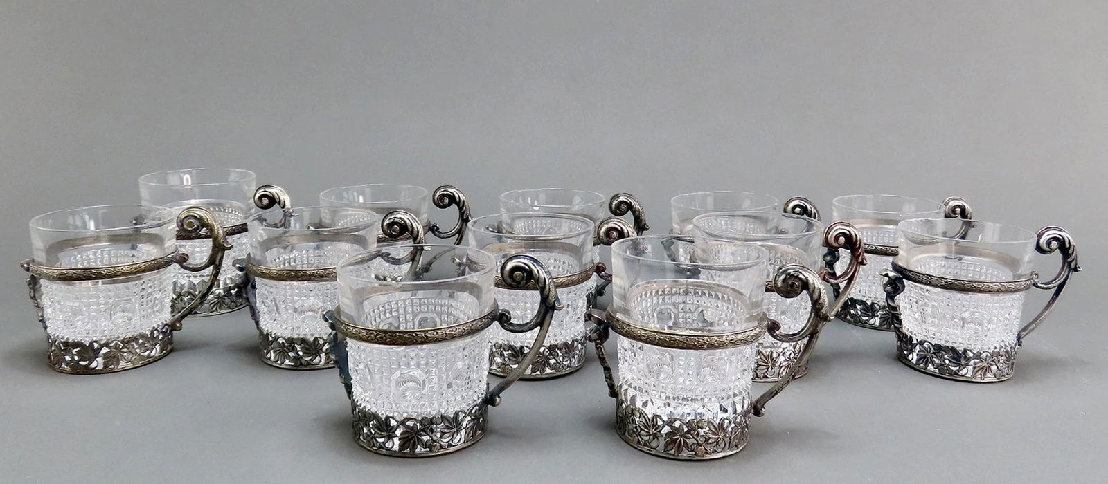 Fantastic VTG Set 12 European Silver Plate Cup Holders w Glass Cups: Composition: SilverplatePresented is a wonderful set of 12 vintage silverplate tea cup holders withglass inserts, dating to around the mid 20th century, likely of continentalEuropean make. The silver