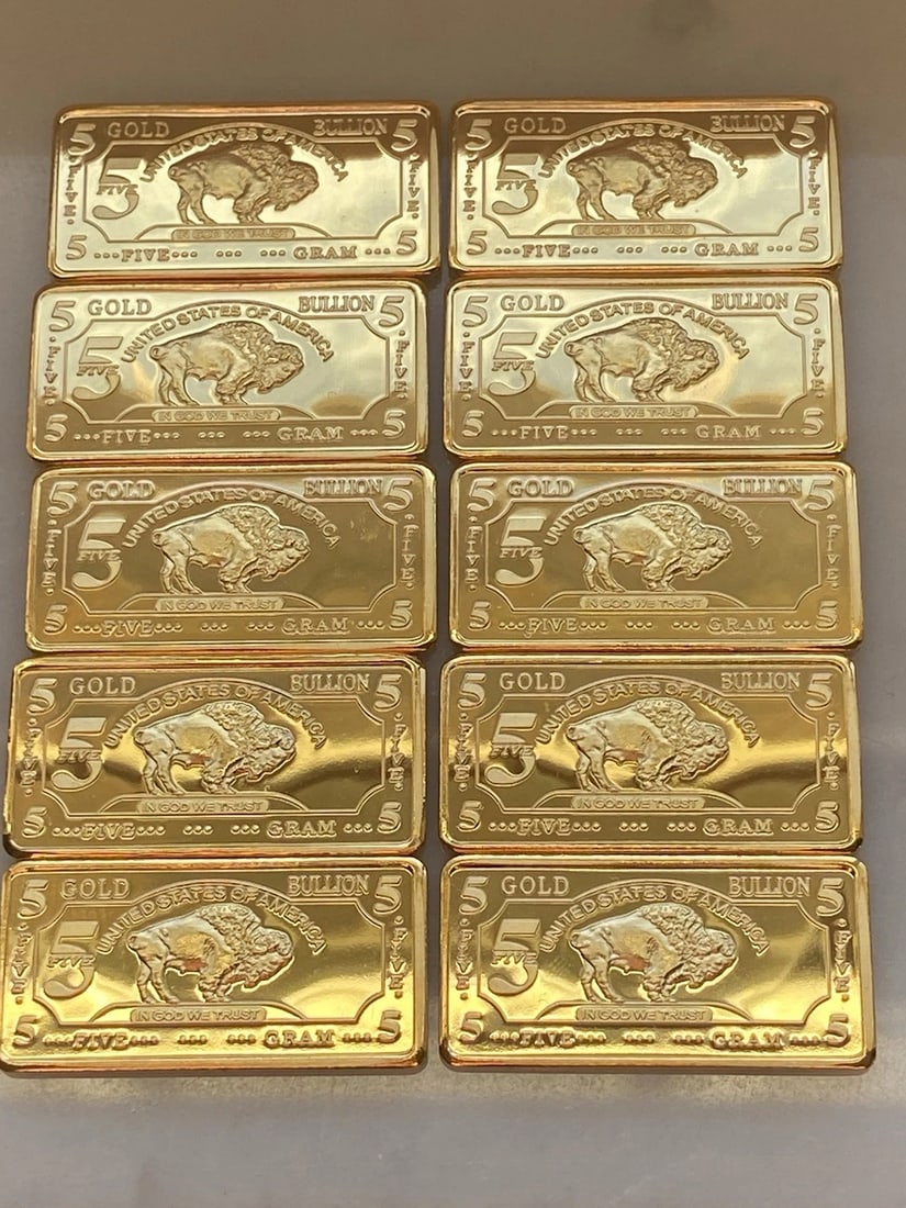 Lot of 10 - 5 GRAM 100 MILLLS GOLD BUFFALO BULLION BARS .999 FINE: 5 gram American Buffalo 100 mills gold clad barFirst These Art Not 10kt,14kt 18kt or 24kt, Just Collector PiecesWith Painted Gold On It10 bars total, 5 grams each Country of Origin: United States,Comp