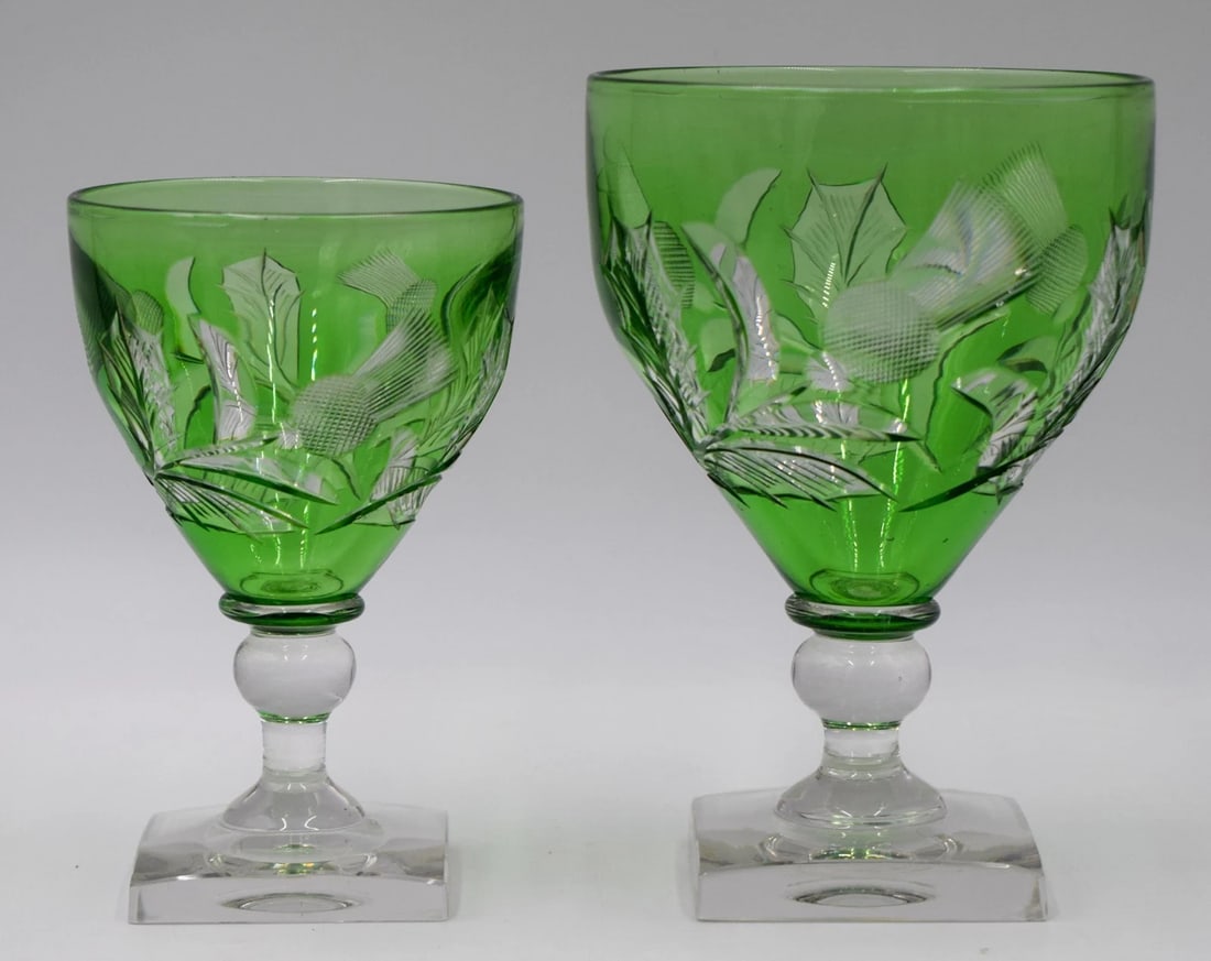 Steuben Ponoma Green Cut to Clear Carved Glass Water & Wine Goblets, Thistles: Steuben Ponoma Green Cut to Clear Carved Glass Water & Wine Goblets, Circa 1920. Very good condition. Measurements: 6" high by 4" wide. 5" high by 3 1/4" wide.