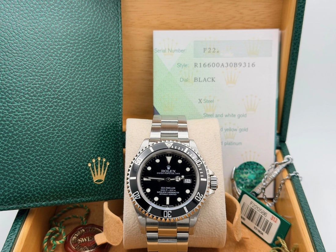 Rolex Sea Dweller 16600 40mm Black Dial Stainless Steel Box Paper: Style Number: 16600Serial: F22****Year: 2005 Model: Rolex Sea Dweller Case Material: Stainless Steel Band: Stainless Steel Bezel: Black Dial: Black Crystal: Sapphire Case Size: 40mm Includes: -