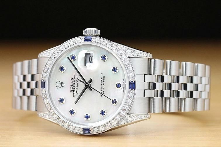 MENS ROLEX DATEJUST MOTHER OF PEARL SAPPHIRE DIAMOND 18K WHITE GOLD SS WATCH: Condition: Pre-owned - Good,Bezel Color: Silver,Max Wrist Size: 7.26-7.5 in,Number of Jewels: 27 Jewels,Indices: Sapphire Markers, 12-Hour Dial,Bezel: Custom 18K White Gold Sapphire Diamond Bezel,Band