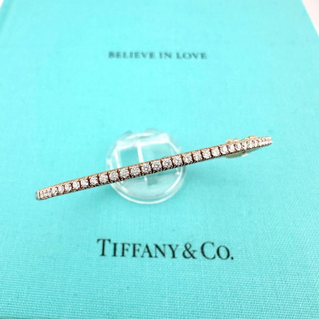 Tiffany & Co 18k Rose Gold Diamond Metro Hinged Bangle Bracelet: Condition: Pre-owned - Good,Number of Diamonds: 41,Main Stone Creation: Natural,Closure: Hinged,Signed: Yes,Main Stone Color: White,Metal: Rose Gold,Item Length: 6 in,Total Carat Weight: 0.61,Main Sto