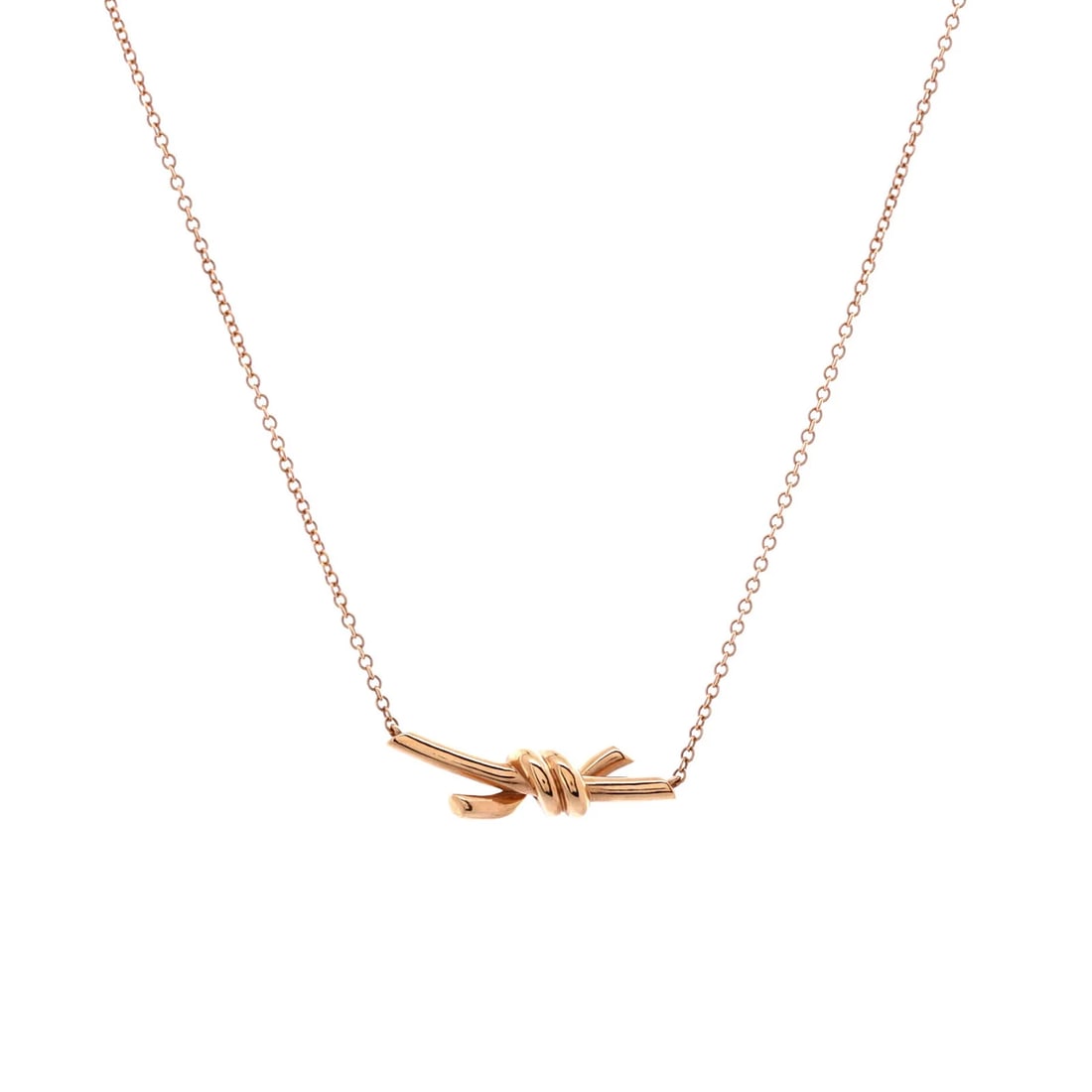 Tiffany & Co. Knot Pendant Necklace 18K Rose Gold: Measurements: Length: 17.00 - 15.00 ", Pendant Length: 6.70 mm, Pendant Width: 21.25 mm. Condition: Pre-owned - Good,Brand: Tiffany & Co.,Main Stone: Unknown,Metal: 18K Rose Gold,Metal Purity: 18K,Sty