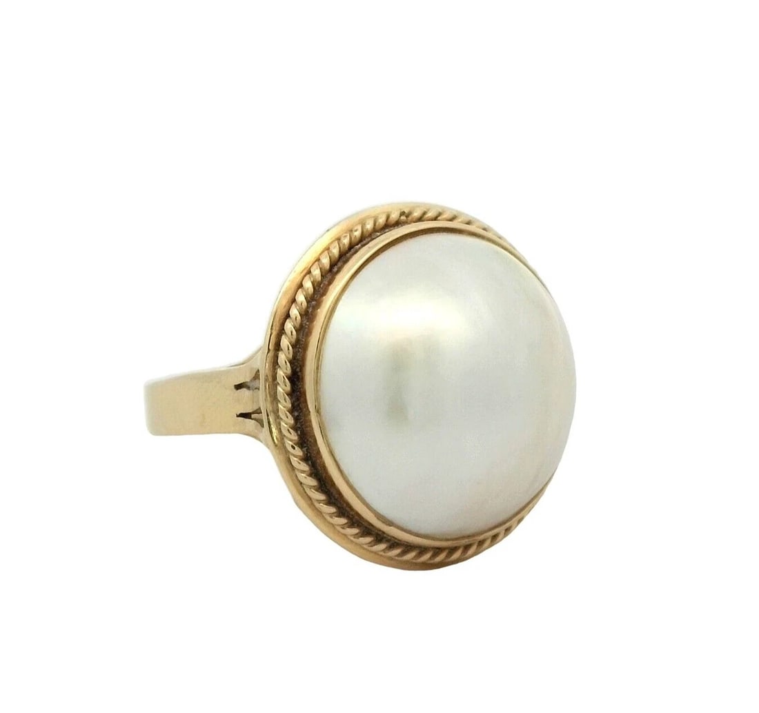 Pearl Ring In 18K Yellow Gold: Condition: Pre-owned - Good,Brand: Unbranded,Ring Size: 7,Type: Ring,Metal Purity: 18k,Main Stone Shape: Round,Color: Yellow,Sizable: Yes,Band Width: 3 mm,Base Metal: Gold,Metal: Yellow Gold,Number of