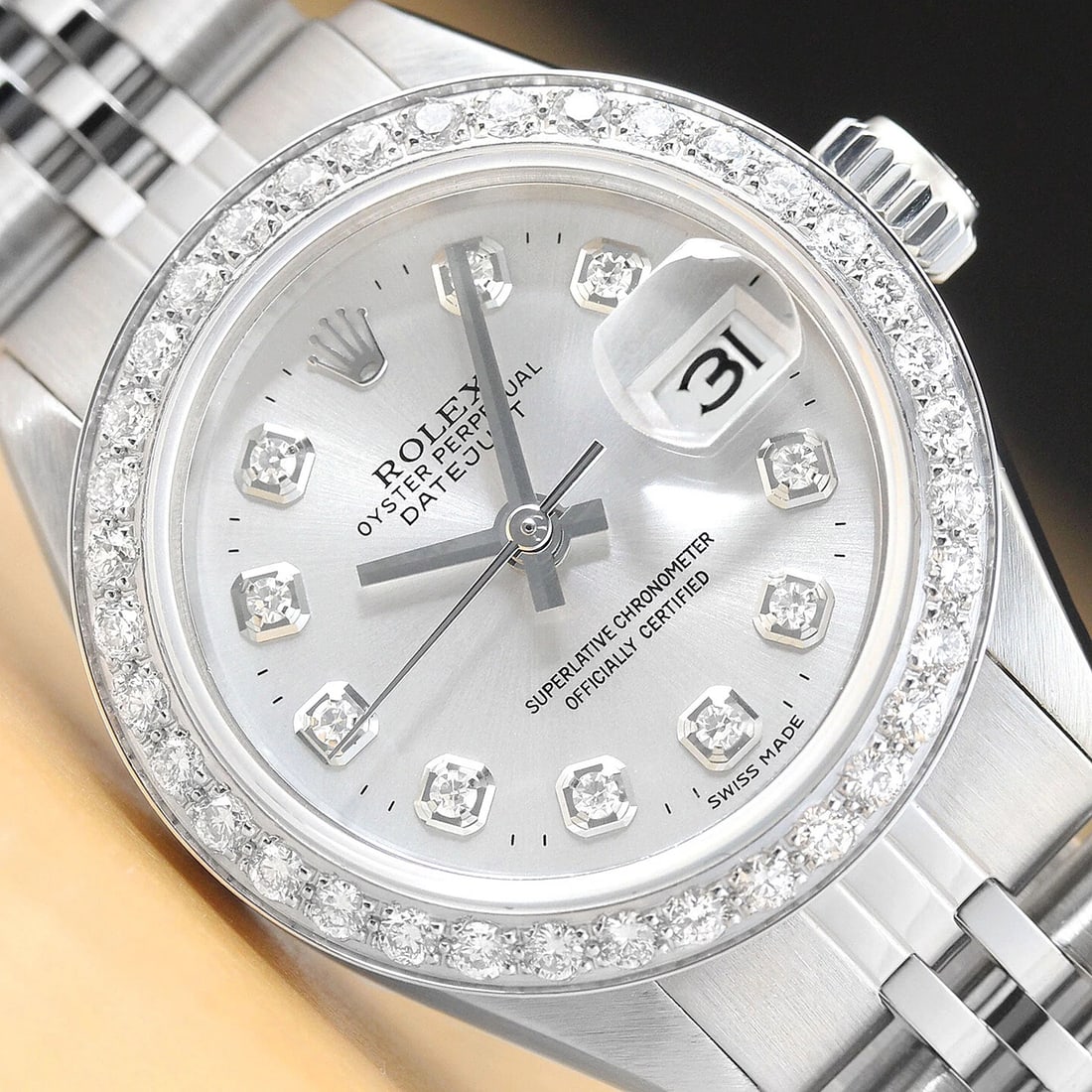 LADIES ROLEX DATEJUST SILVER DIAMOND 18K WHITE GOLD & STAINLESS STEEL WATCH: This is an authentic Rolex Datejust 6916 watch with Rolex dial Ref. with added genuine diamond markers, custom 18K white gold diamond bezel, and custom stainless steel jubilee bracelet. Descriptions: