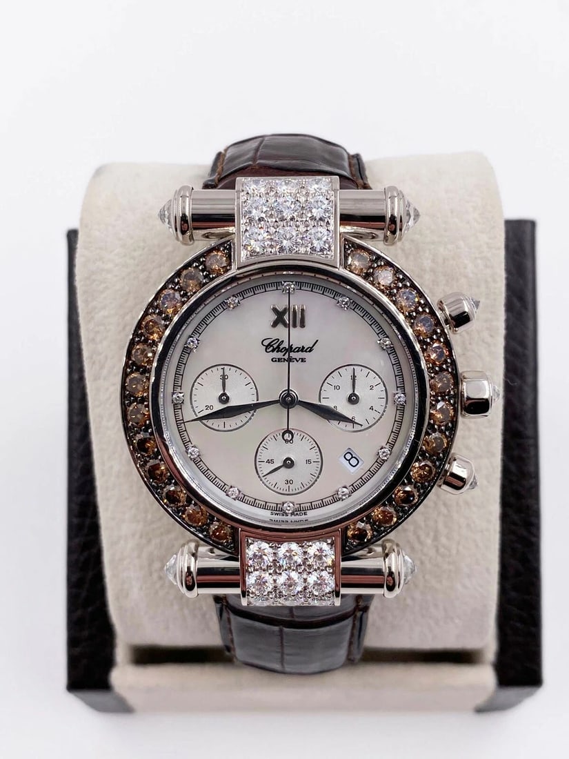 Chopard Imperiale 1215 37 / 3168-52 Chocolate Diamonds MOP 18K White Gold: Style Number: 1215 37 / 3168-52 Model: Imperiale Case Material: 18K White Gold Band: Leather Bezel: Chocolate Diamond Bezel Dial: Original Blue Mother of Pearl with Diamonds Face: Sapphire Crystal Cas