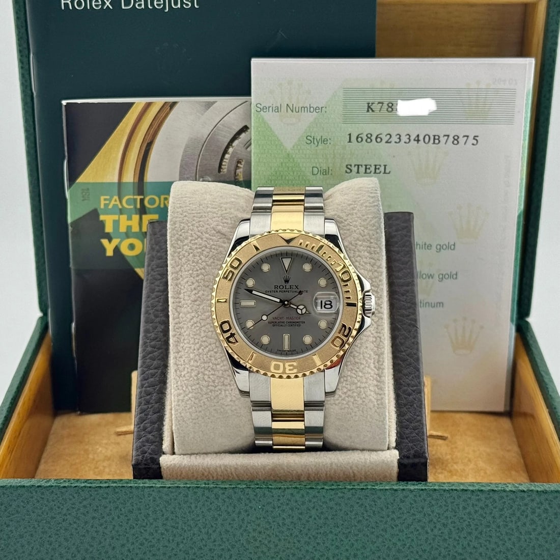 Rolex Yacht-Master Midsize 168623 35mm Silver Dial 18K Gold Steel Box Paper: Style Number: 168623Serial: K788***Year: 2003 Model: Rolex Yacht-Master Midsize Case Material: Stainless Steel Band: 18K Yellow Gold & Stainless Steel Bezel: 18K Yellow Gold Dial: Silver Face: Sapphir