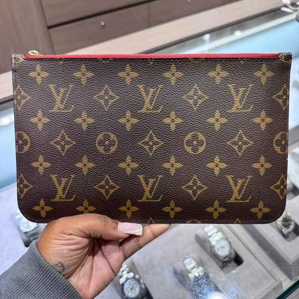 Louis Vuitton Monogram Wristlet with Cherry Interior: Condition: Pre-owned - Good,Brand: Louis Vuitton,Pattern: Monogram,Department: Women,Exterior Color: Brown,Style: Clutch,Exterior Material: Canvas,Product Line: Louis Vuitton NeverfullThis chic and ve