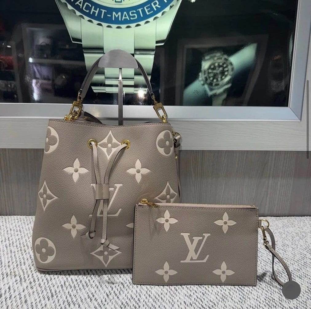 Louis Vuitton NéoNoé MM Colors Bi-Color Empreinte leather w/Wristlet (2020): Condition: Pre-owned - Excellent,Brand: Louis Vuitton,Department: Women,Exterior Color: Tourterelle Gray / Cream,Style: Satchel/Top Handle Bag,Exterior Material: grained cowhide leatherThis elegant Lo