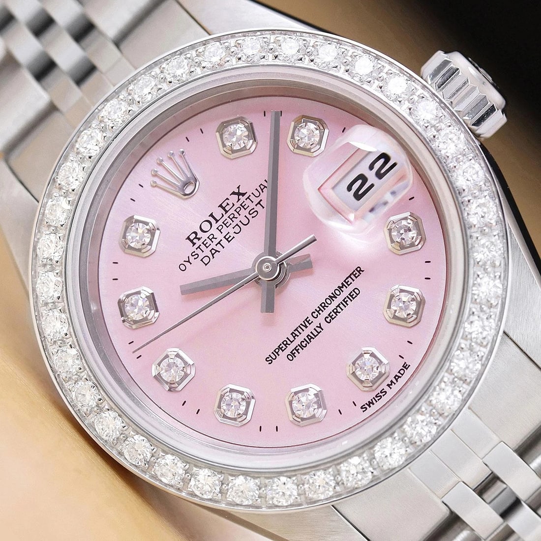 ROLEX LADIES DATEJUST 79174 PINK DIAL 18K WHITE GOLD STEEL DIAMOND WATCH: This is an authentic Rolex Datejust 79174 no holes watch with Rolex stainless steel jubilee bracelet, Rolex dial Ref. with added diamond markers, and custom 18K white gold diamond bezel. Descriptions: