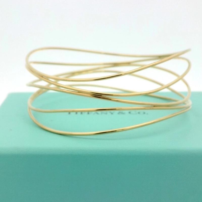 Vintage Tiffany & Co Elsa Peretti Five-Row Wave Bangle in 18k Yellow Gold: Weight: 18.7 gr. Condition: Pre-owned - Good,Brand: Tiffany & Co.,Type: Bracelet,Metal Purity: 18k,Color: Yellow,Model: Tiffany & Co. Elsa Peretti Wave,Style: bracelet,Base Metal: Gold,Metal: Yellow