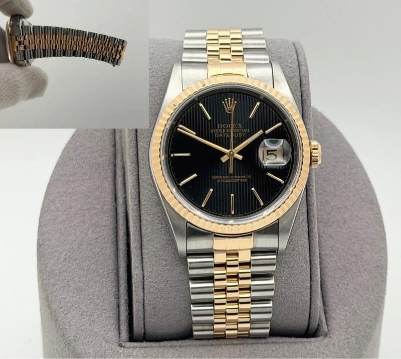 Rolex Datejust 16233 36mm Black Tapestry Dial 18k Yellow Gold Stainless Steel: Style Number: 16233Serial: W56****Year: 1995 Model: Rolex Datejust Case Material: Stainless Steel Band: 18k Yellow Gold & Stainless Steel Jubilee Bezel: 18k Yellow Gold Fluted Dial: Black Tapestry Cry