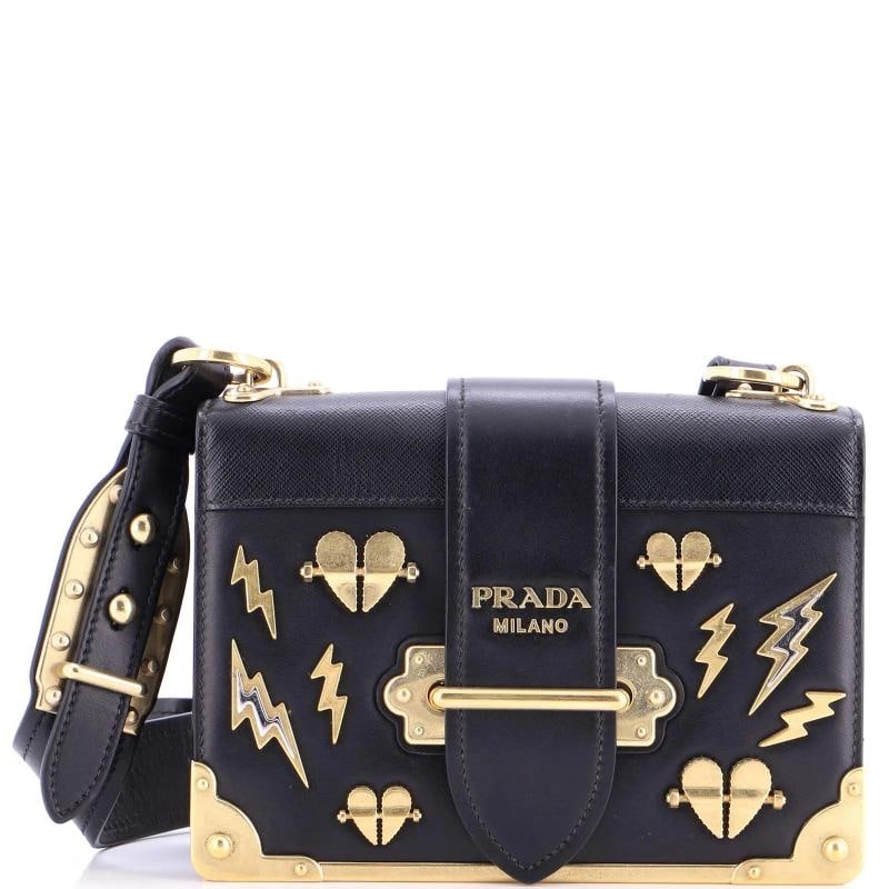 Prada Cahier Crossbody Bag Embellished Leather Small: Accessories: With StrapMeasurements: Height 5", Width 8", Depth 3", Strap Drop 17.5-21.5". Condition: Pre-owned - Excellent,Brand: Prada,Exterior Material: Leather,Style: Cross Body Bags,Exterior