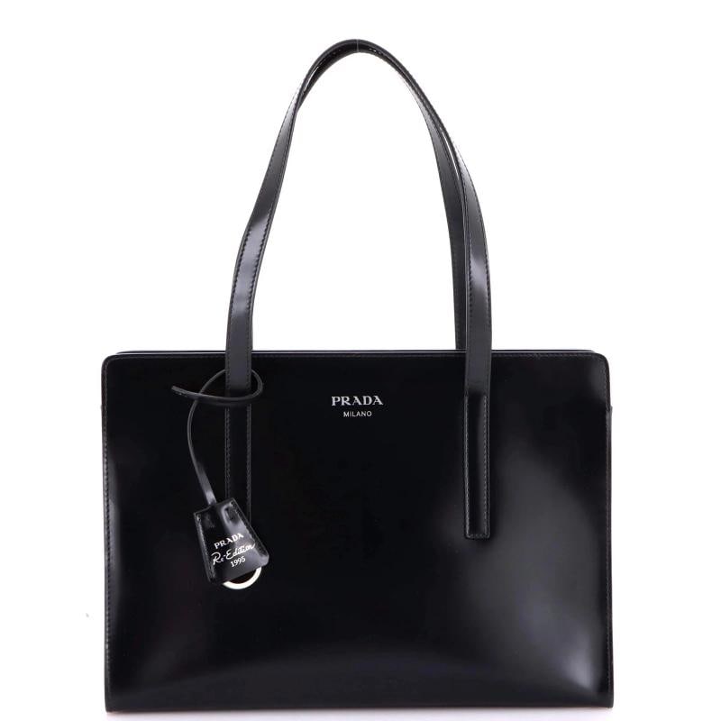 Prada Re-Edition 1995 Top Handle Tote Spazzolato Leather Medium: Accessories: Clochette Measurements: Height 8", Width 12", Depth 3". Condition: Pre-owned - Good,Brand: Prada,Exterior Material: Leather,Style: Top Handle,Exterior Color: Black,Department: Women,Size: