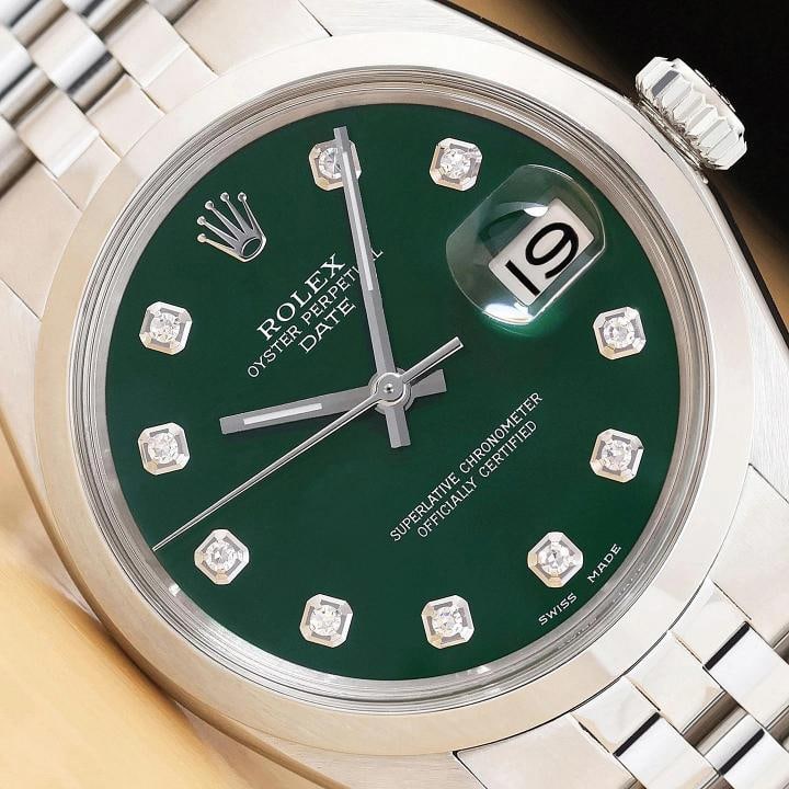 ROLEX OYSTER PERPETUAL DATE 1500 GREEN DIAMOND DIAL STAINLESS STEEL 34MM WATCH: This is an authentic Rolex Oyster Perpetual Date 1500 34 mm watch with Rolex dial Ref. with added diamond markers, Rolex stainless steel smooth bezel, and custom stainless steel jubilee bracelet..