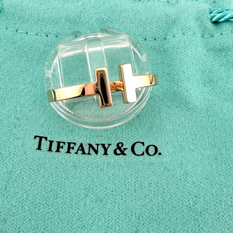 Tiffany & Co 18K Rose Gold Tiffany T Square Ring Size 9.5: Condition: Pre-owned - Good,Brand: Tiffany & Co.,Ring Size: 9.5,Type: Ring,Metal Purity: 18k,Signed: Yes,Sizable: No,Base Metal: Gold,Collection: Tiffany & Co. Tiffany T,Metal: Rose Gold,Main Stone: