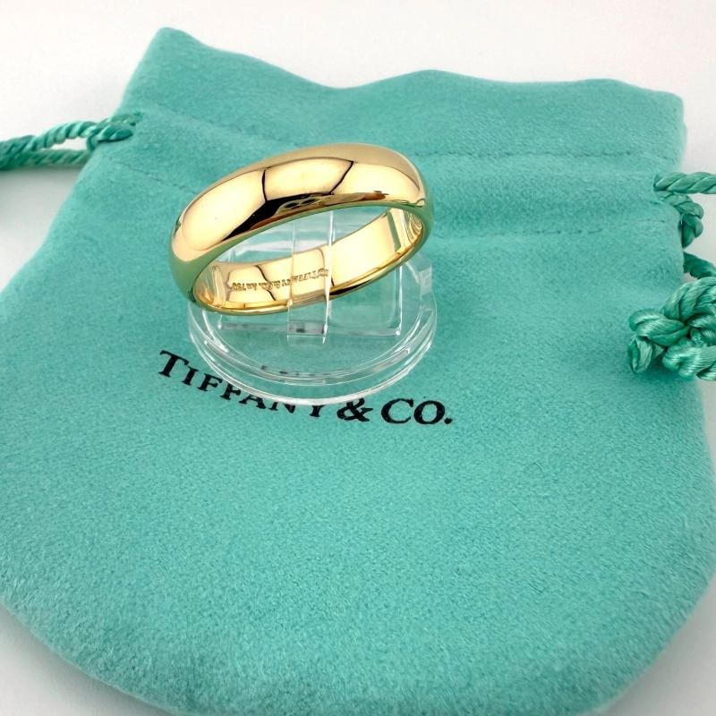 Tiffany & Co 18k Yellow Gold Forever 6mm Band Ring: Condition: Pre-owned - Good,Materials sourced from: United States,Country of Origin: United States,Antique: No,Occasion: Wedding,Signed: Yes,Color: Yellow,Sizable: Yes,Metal: Yellow Gold,Main Stone: