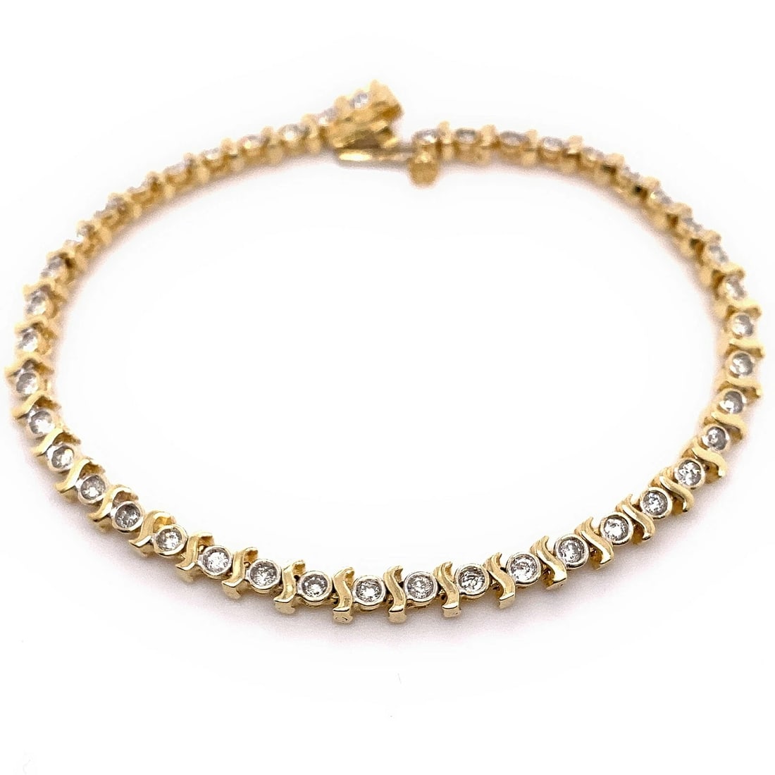Round Brilliant Diamonds S Link 14kt Yellow Gold Tennis Bracelet: Condition: Pre-owned - Good,Number of Diamonds: 43,Main Stone Creation: Natural,Color: White,Main Stone Color: White,Metal: Yellow Gold,Item Length: 6.7 in,Total Carat Weight: 1.00 ctw - 1.24 ctw,Main