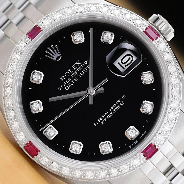 ROLEX MENS DATEJUST 16234 BLACK FACTORY DIAMOND RUBY 18K WHITE GOLD STEEL WATCH: This is an authentic Rolex Datejust 16234 watch with an original Rolex stainless steel jubilee bracelet, factory Rolex diamond dial Ref., and custom 18K white gold diamond ruby bezel. Descriptions: Br