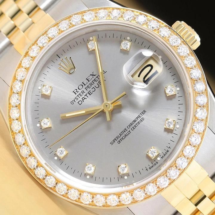 ROLEX DATEJUST 16233 GRAY FACTORY DIAMOND 1.6 CT BEZEL 18K GOLD STEEL WATCH: This is an authentic Rolex Datejust 16233 watch with a two tone 18K yellow gold and stainless steel jubilee bracelet, factory Rolex diamond dial Ref., and custom 18K yellow gold 1.6 CT diamond bezel.