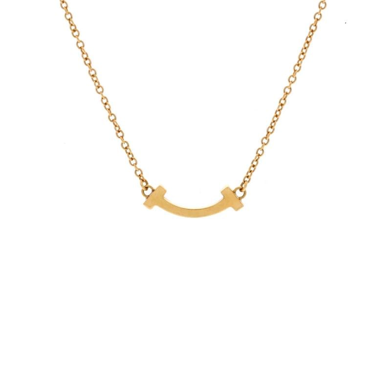 Tiffany & Co. T Smile Pendant Necklace 18K Yellow Gold Mini: Condition: Pre-owned - Good,Brand: Tiffany & Co.,Main Stone: Unknown,Metal: 18K Yellow Gold,Metal Purity: 18K,Style: Pendant,Type: Necklace,Color: Yellow Gold,Material: 18K Yellow Gold Low Estimate:
