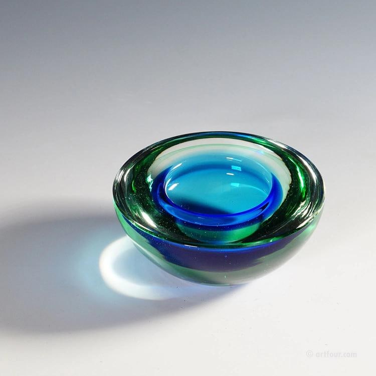 Archimede Seguso Geode Bowl in Green and Blue, Murano Italy ca. 1950s: A heavy Venetian art glass bowl in the shape of a geode designed by Archimede Seguso for Vetreria Artistica Archimede Seguso ca. 1950s. Thick sommerso glass with blue inside, and green a clear glass