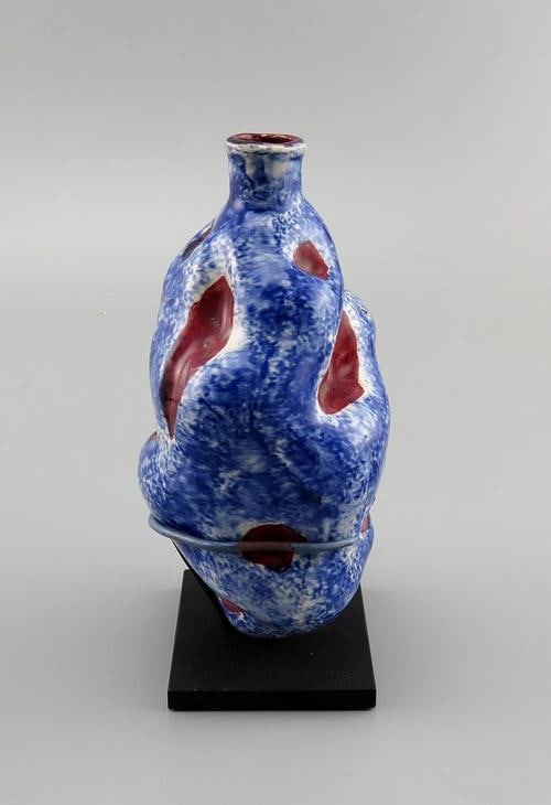 Rare c1820-1860s Blue Speckled American Folk Art Pottery Potato Flask: The flask itself measures about 5 1/2 x 3 1/2 x 2 3/4 or about 5 7/8 inches high on its stand. Low Estimate: 700.00 High Estimate: 1000.00