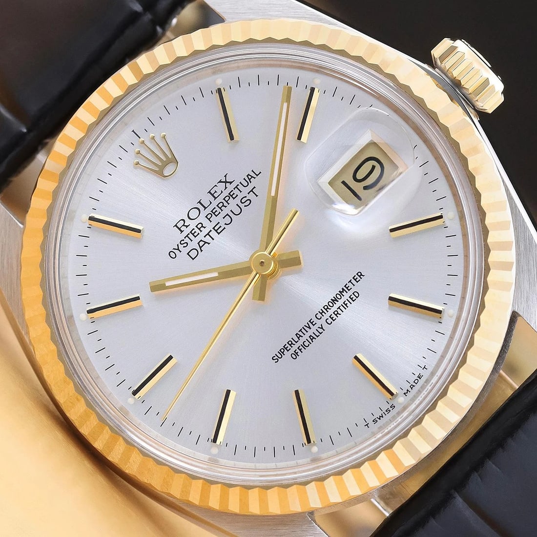 ROLEX MENS DATEJUST 16013 SILVER DIAL 18K GOLD STEEL WATCH w/ BLACK LEATHER BAND: This is an authentic Rolex Datejust 16013 watch with Rolex stick dial Ref., Rolex 18K yellow gold fluted bezel, and custom genuine black leather strap. Descriptions: Brand:RolexModel:DatejustReference