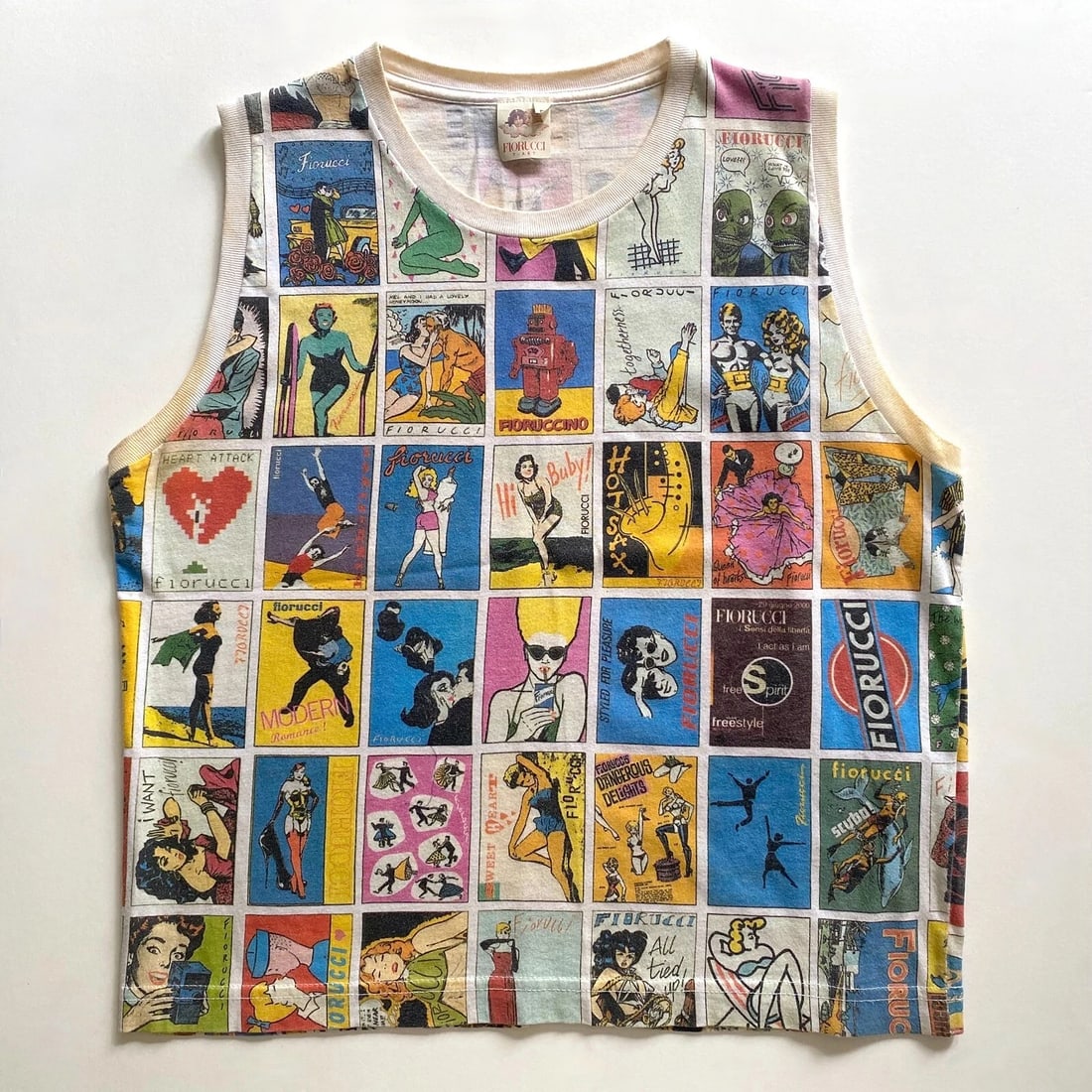 FIORUCCI RARE VTG 1980'S WOMEN'S NEW WAVE ITALIAN FASHION COMICS POP ART T-SHIRT: THE RARE VINTAGE FIORUCCI POP ART T-SHIRT IS A SIZE MEDIUM. THE ACTUAL MEASUREMENTS ARE 18" UNDERARM TO UNDERARM, 13" SHOULDER TO SHOULDER, 12" UNDERARM TO BOTTOM HEM, 19 1/4" CENTER BACK COLLAR SEAM