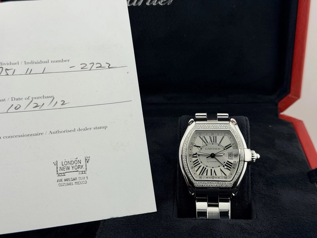 Cartier Roadster GMT XL 2722 42mm Diamond Bezel Silver Dial Steel Box Paper: Style Number: 2722Serial: 75/7****Year: 2012 Model: Cartier Roadster GMT XL Case Material: Stainless Steel Band: Stainless Steel Bezel: Custom Diamond Bezel Dial: Silver Dial Crystal: Sapphire Case Si