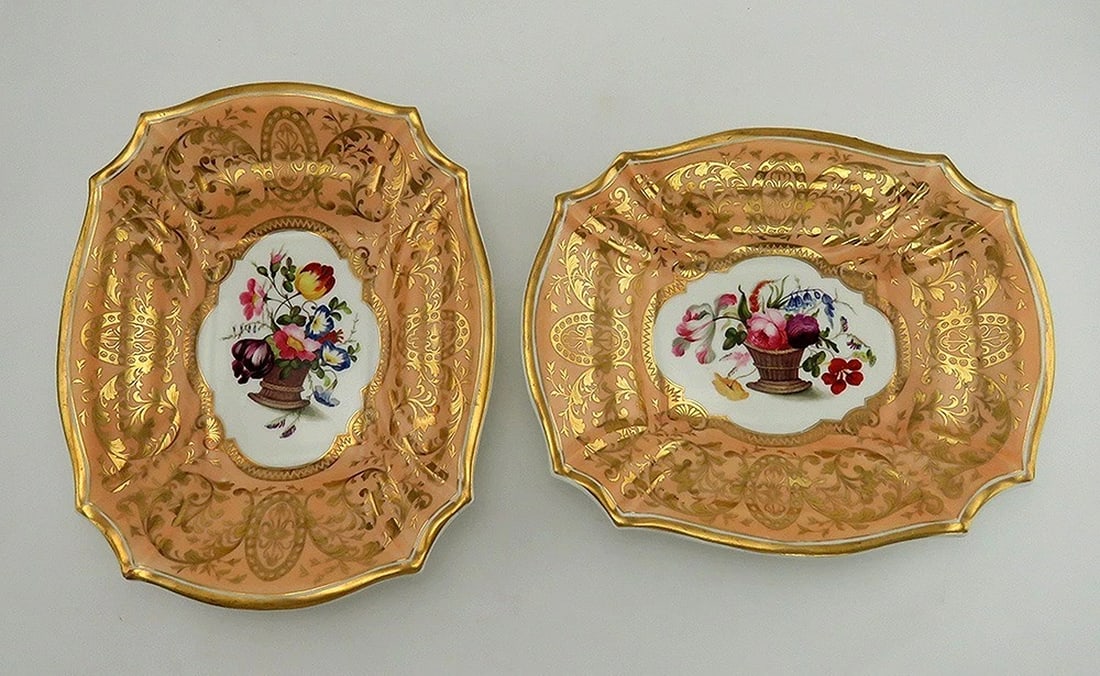Antique c1815 Pair Hand Painted Gilded Floral English Porcelain Serving Dishes: an antique pair of Georgian English porcelain serving dishes made during the early 19th century, circa 1810-1820. Each dish is in a ruffled rectangular shape with slightly pleated sides. Each plate be