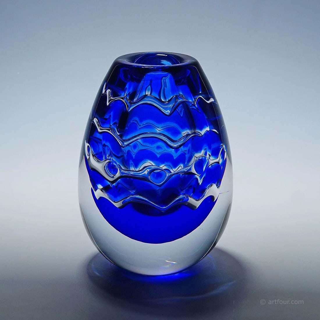 Unique Ariel Vase by Mikael Kenlind for Vase Vitreum, Sweden: A heavy vase of the Ariel Unique series designed by Mikael Kenlind for Vase Vitreum Sweden. Colorless glass with a blue overlay, cooled, cutted with a geometrical pattern, re-heated and cased with col