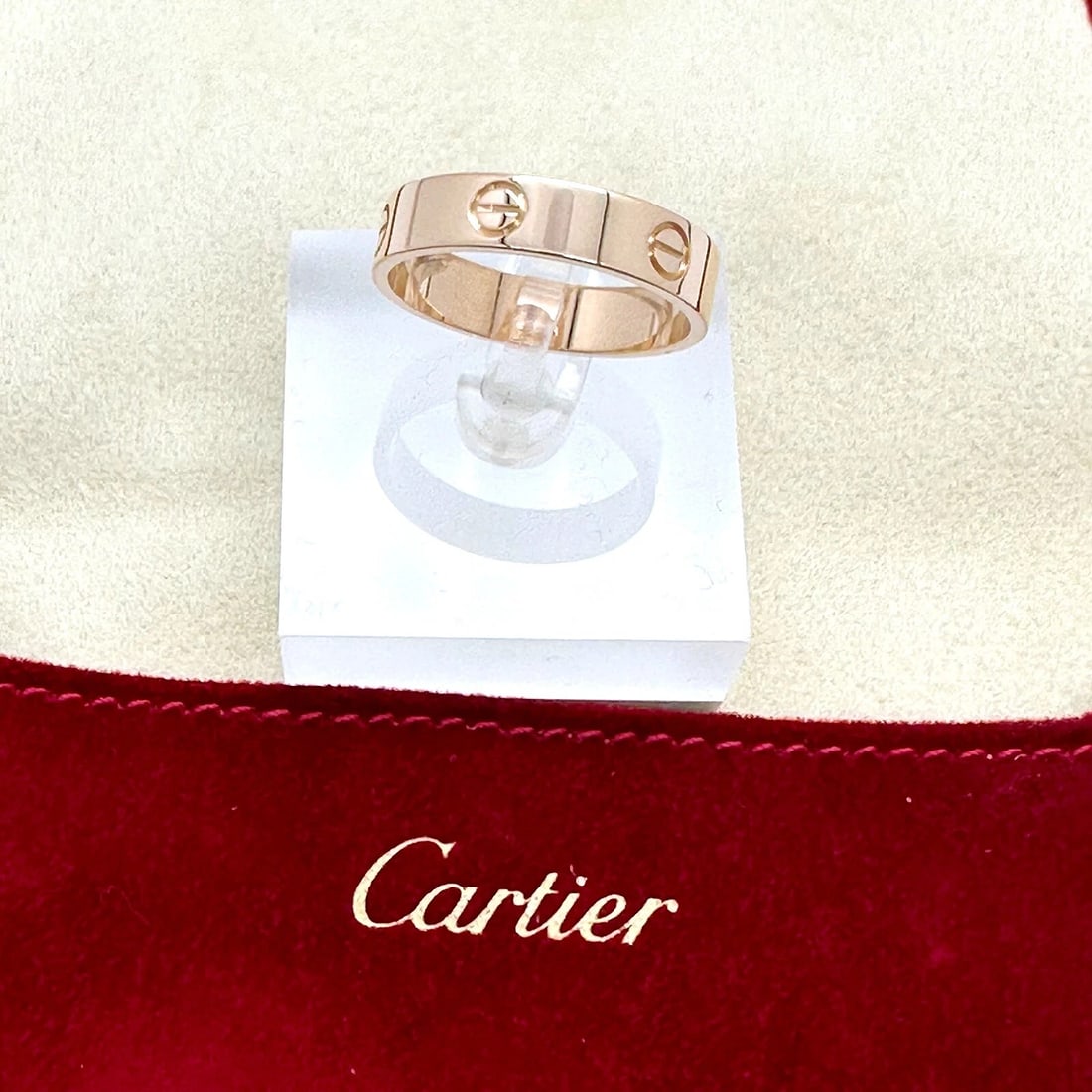 CARTIER Love Ring in Pink Gold Size 68 5.5 MM: Condition: Pre-owned - Good: This item has been gently used but is in good condition. It might have a few signs of wear, like light scratches or tarnishing. All imperfections should be shown and descr